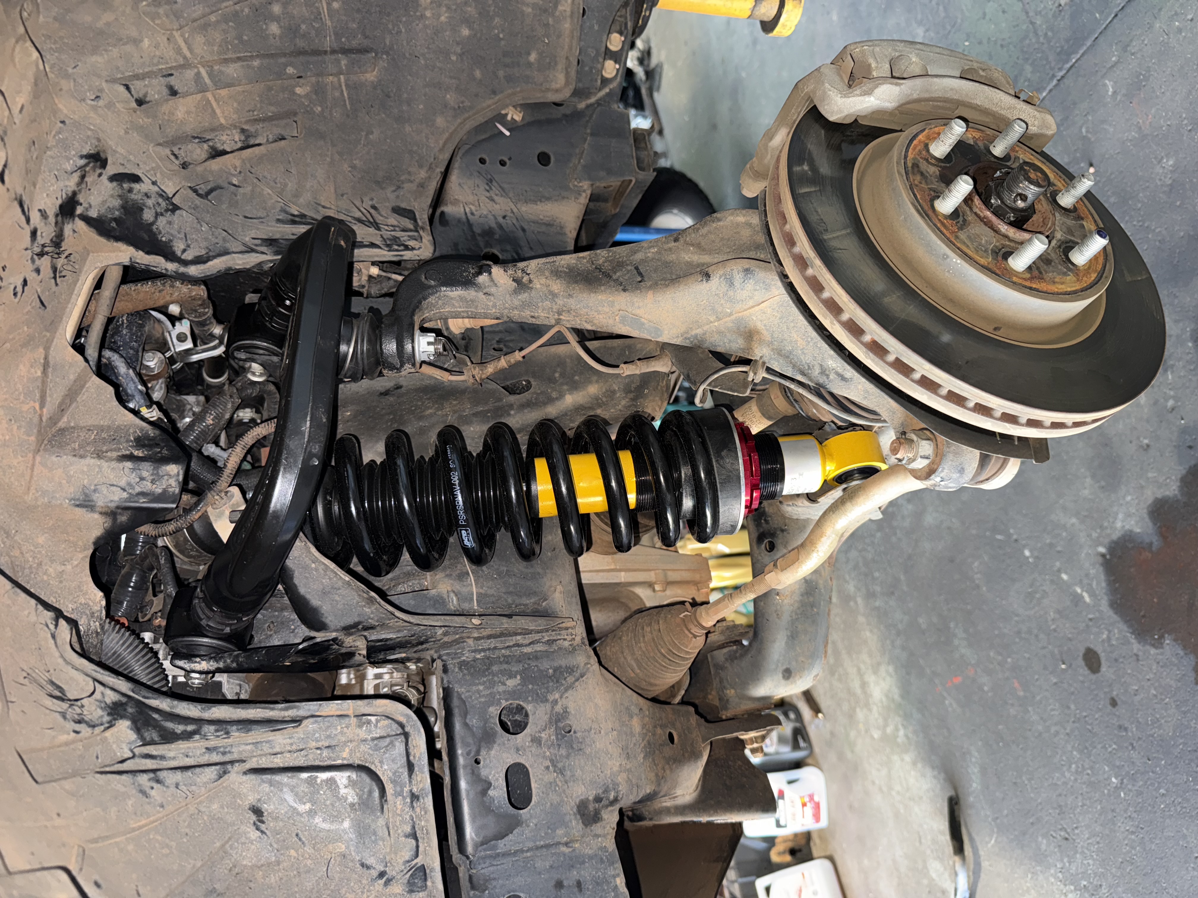 Suspension strut and brake rotor assembly during 4x4 upgrade in Darwin