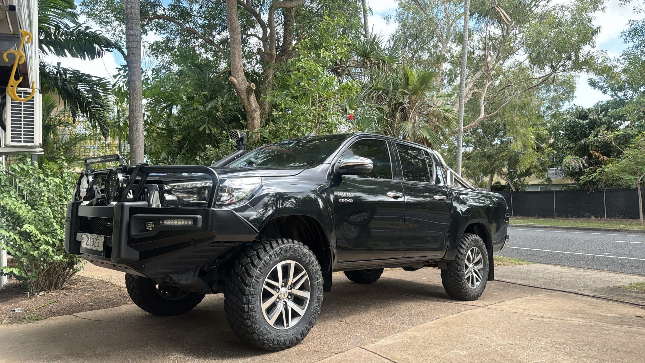 4x4 ute on a hoist inside the Outlaw Marine and 4x4 workshop in Coconut Grove NT