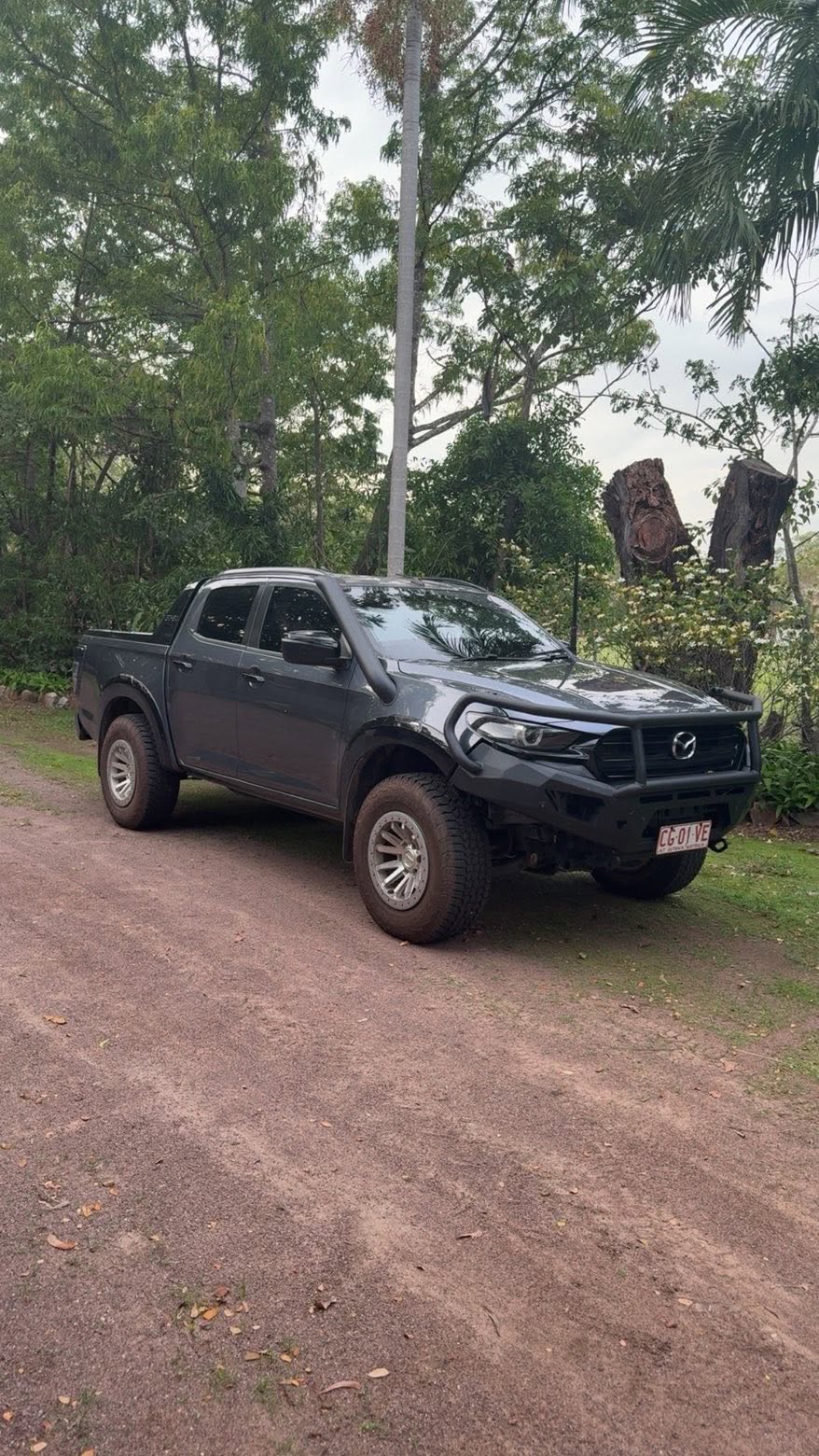 Underside of a 4WD ute on the hoist showing coilover suspension